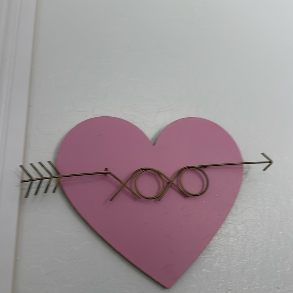 Beautiful pink wooden heart with metal arrow through it wall decor for home